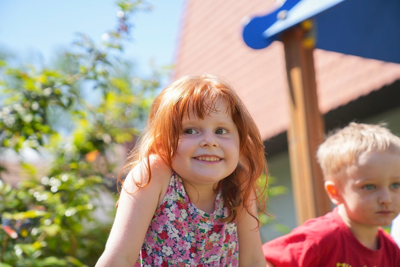 smiling girl kindergarten italy